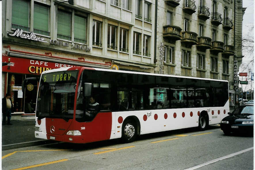 (066'132) - TPF Fribourg - Nr. 388/FR 300'393 - Mercedes am 21. Mrz 2004 beim Bahnhof Fribourg