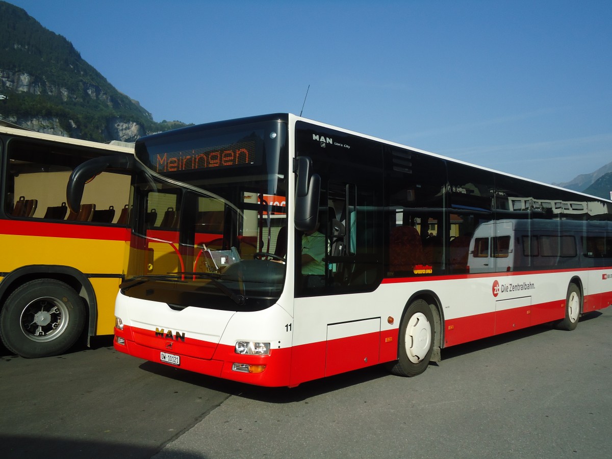 (135'665) - Dillier, Sarnen - Nr. 11/OW 10'121 - MAN am 21. August 2011 beim Bahnhof Meiringen