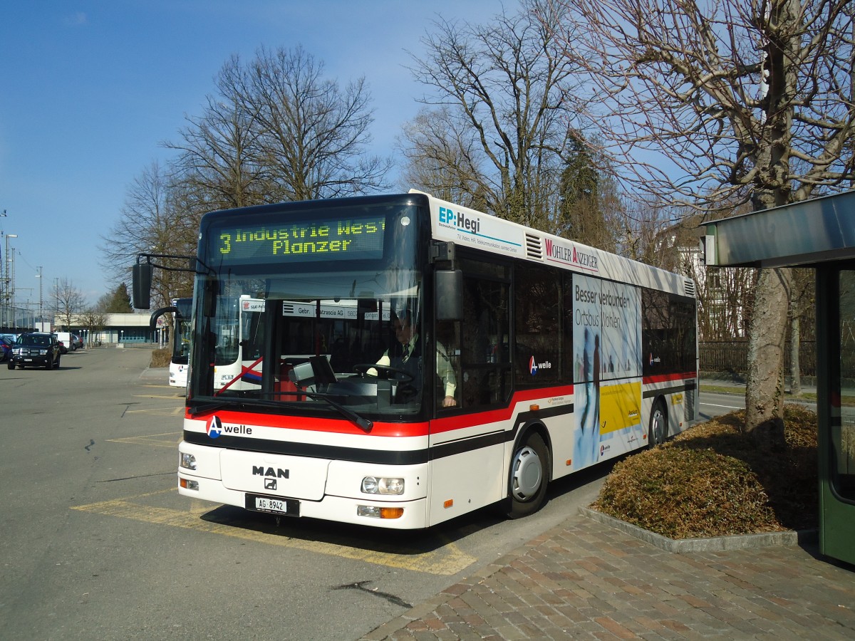 (138'058) - Geissmann, Hgglingen - AG 8942 - MAN am 6. Mrz 2012 beim Bahnhof Wohlen