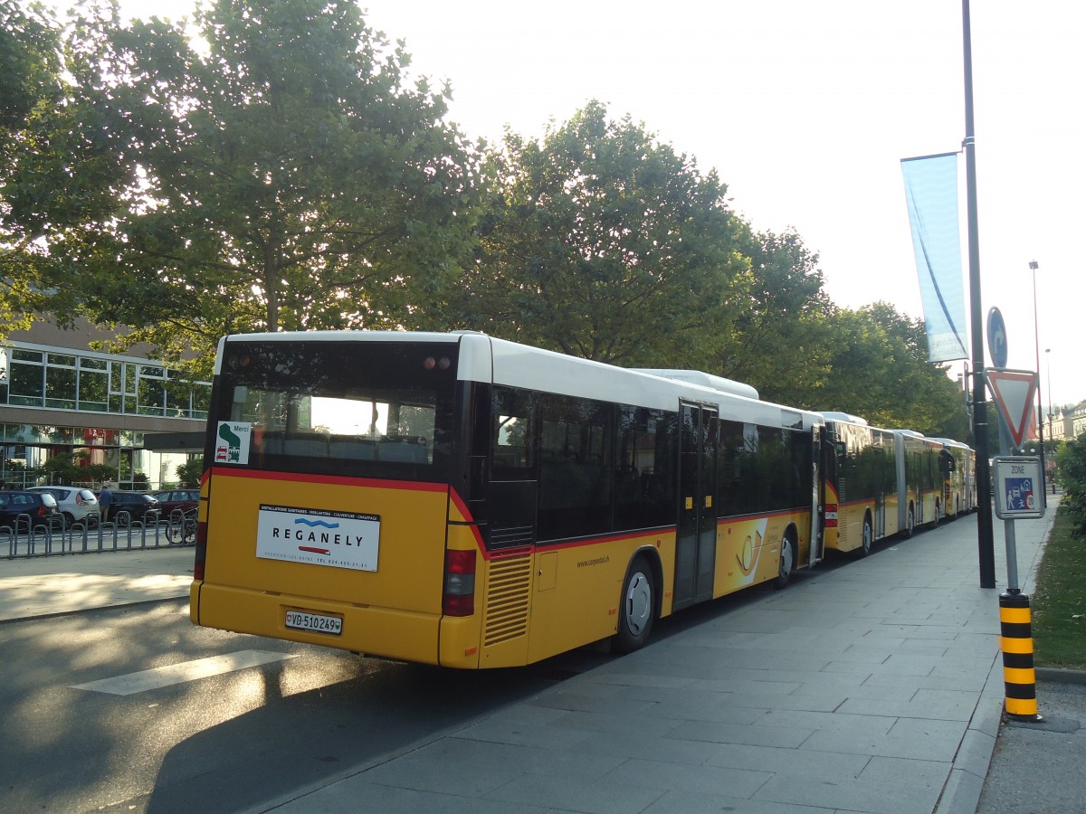 (140'956) - CarPostal Ouest - VD 510'249 - MAN (ex P 25'587) am 27. Juli 2012 beim Bahnhof Yverdon