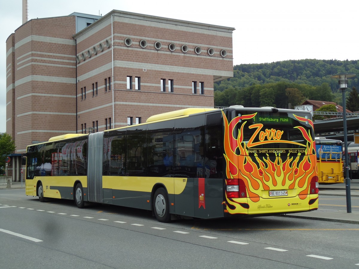 (144'524) - STI Thun - Nr. 145/BE 801'145 - MAN am 25. Mai 2013 beim Bahnhof Spiez