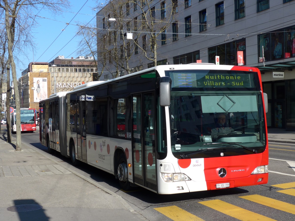 (149'278) - TPF Fribourg - Nr. 596/FR 300'398 - Mercedes am 9. Mrz 2014 beim Bahnhof Fribourg