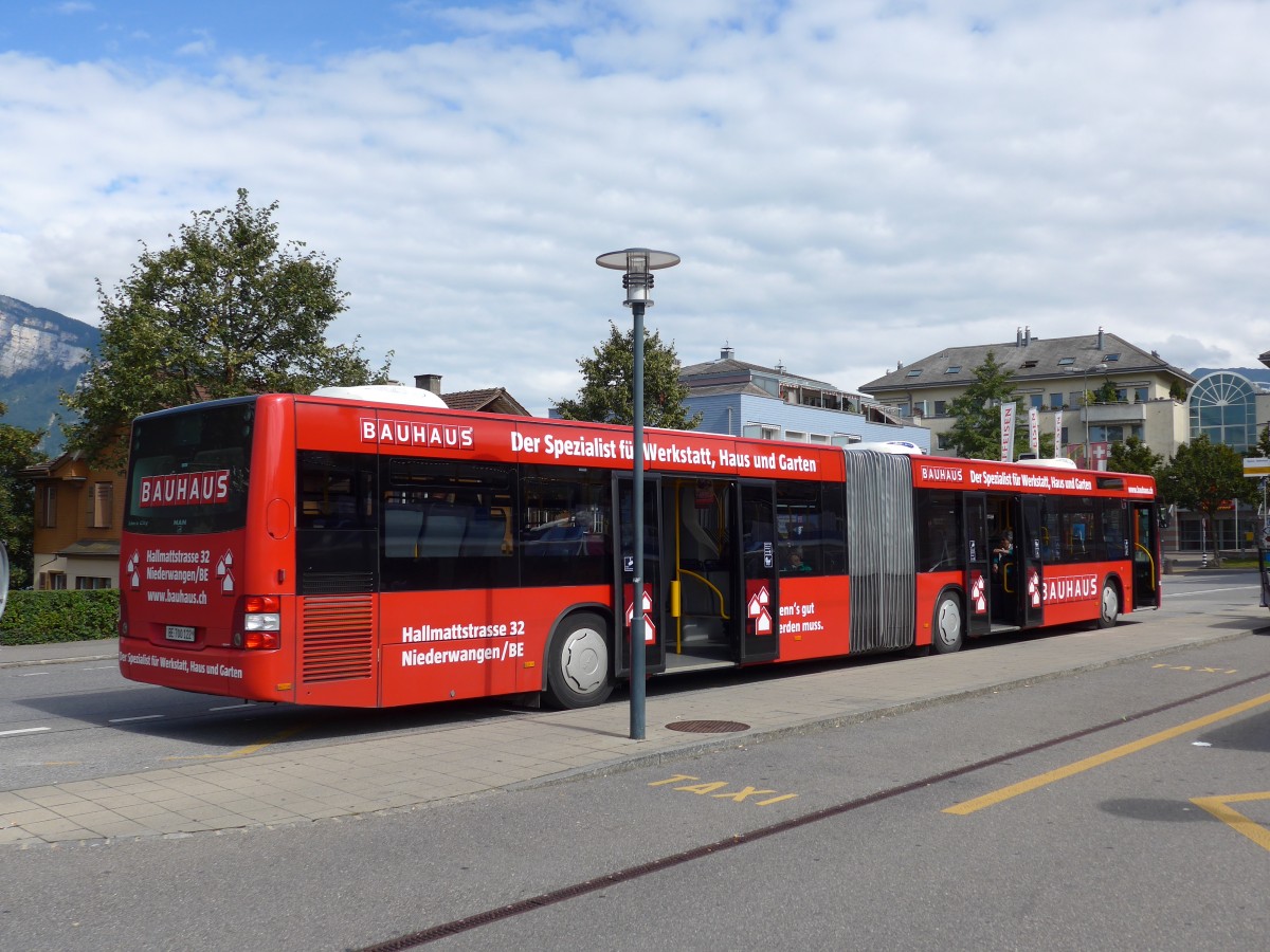 (154'418) - STI Thun - Nr. 122/BE 700'122 - MAN am 24. August 2014 beim Bahnhof Spiez