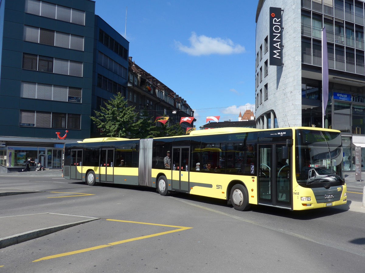 (155'261) - STI Thun - Nr. 145/BE 801'145 - MAN am 14. September 2014 beim Bahnhof Thun