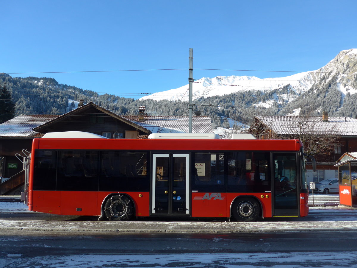 (200'209) - AFA Adelboden - Nr. 56/BE 611'030 - Scania/Hess am 25. Dezember 2018 beim Bahnhof Lenk