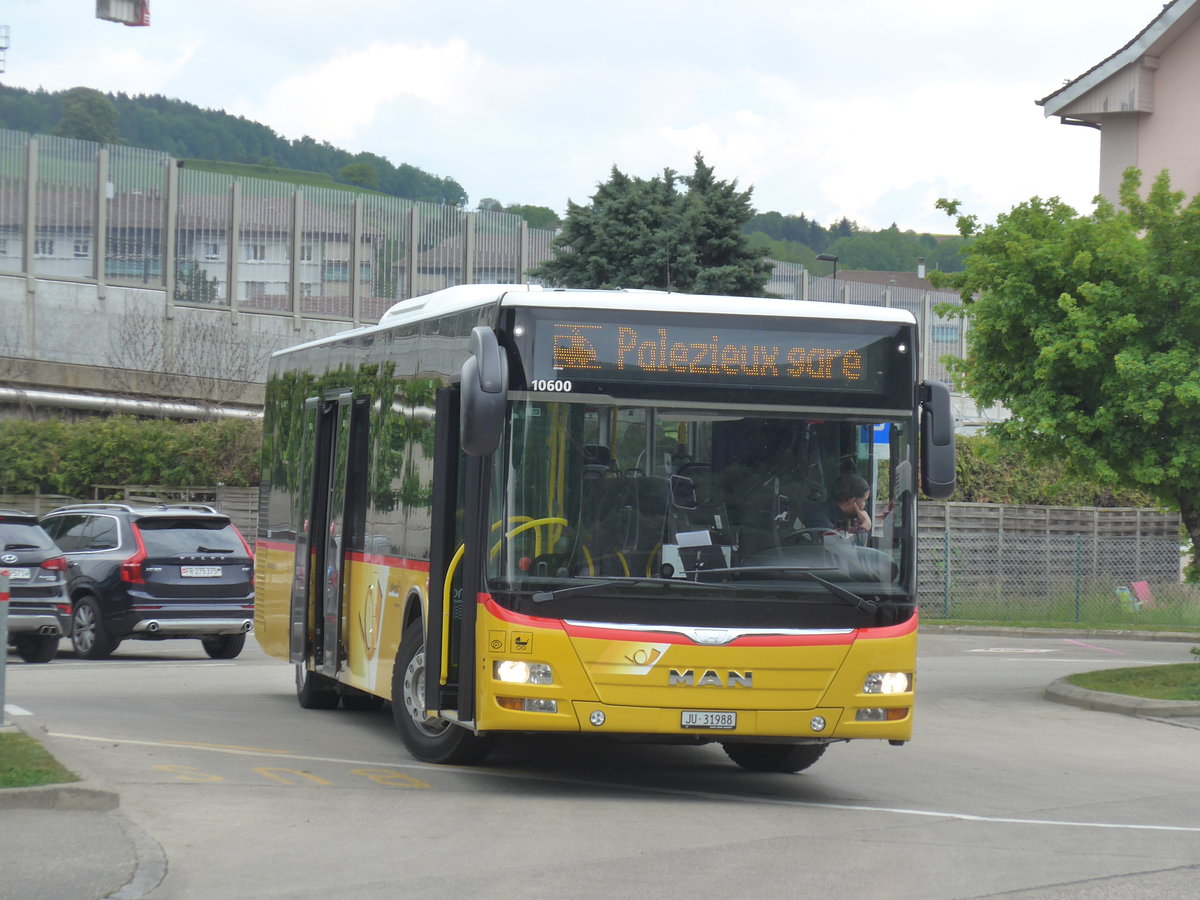 (205'456) - CarPostal Ouest - JU 31'988 - MAN am 25. Mai 2019 beim Bahnhof Moudon