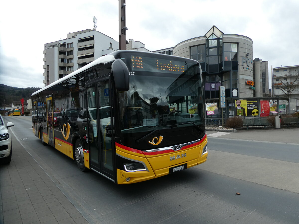 (232'687) - PostAuto Nordschweiz - BL 224'307 - MAN am 6. Februar 2022 beim Bahnhof Laufen