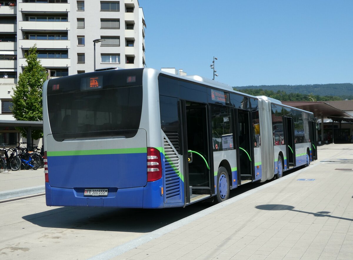 (252'407) - Intertours, Domdidier - Nr. 555/FR 300'555 - Mercedes (ex Nr. 12; ex TPL Lugano Nr. 412) am 7. Juli 2023 beim Bahnhof Laufen