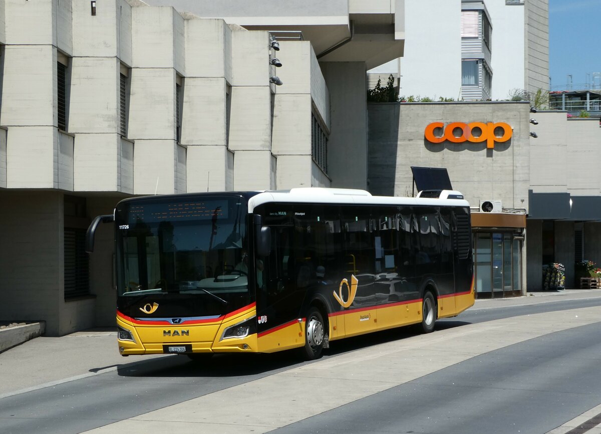 (252'425) - PostAuto Nordschweiz - BL 224'306/PID 11'726 - MAN am 7. Juli 2023 beim Bahnhof Laufen