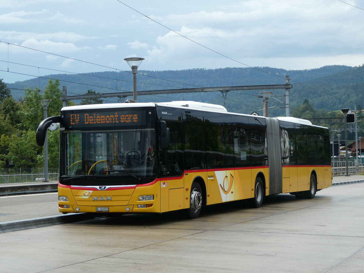 (253'674) - PostAuto Nordschweiz - BL 140'022/PID 10'830 - MAN am 12. August 2023 beim Bahnhof Laufen