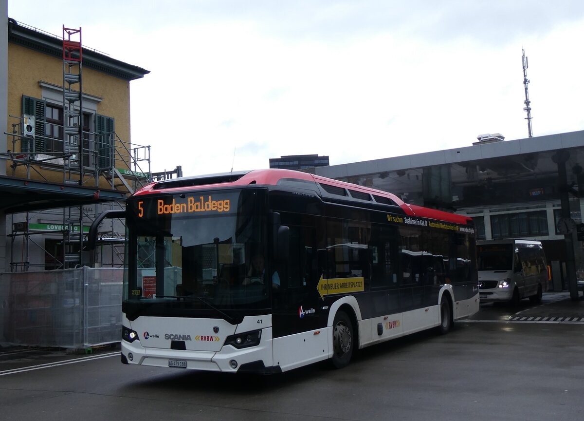 (260'740) - RVBW Wettingen - Nr. 41/AG 479'188 - eScania am 28. Mrz 2024 beim Bahnhof Baden