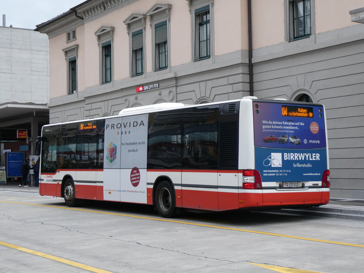 (261'124) - StadtBUS, Frauenfeld - Nr. 712/TG 273'012 - MAN (ex PostAuto Ostschweiz PID 10'104) am 9. April 2024 beim Bahnhof Frauenfeld