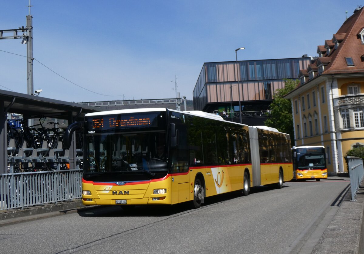 (261'185) - PostAuto Nordschweiz - AG 485'320/PID 10'272 - MAN am 12. April 2024 beim Bahnhof Baden