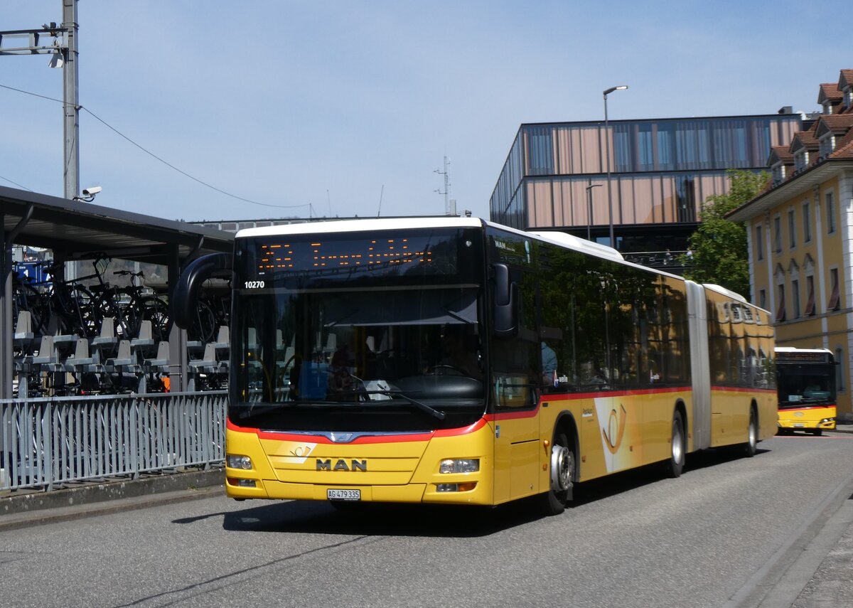 (261'194) - PostAuto Nordschweiz - AG 379'335/PID 10'270 - MAN am 12. April 2024 beim Bahnhof Baden