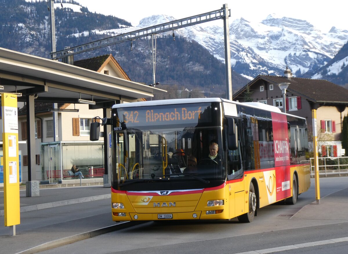 (269'966) - PostAuto Zentralschweiz - Nr. 504/OW 10'004/PID 10'777 - MAN (ex Nr. 10; ex Dillier, Sarnen Nr. 10) am 17. Dezember 2024 beim Bahnhof Sarnen