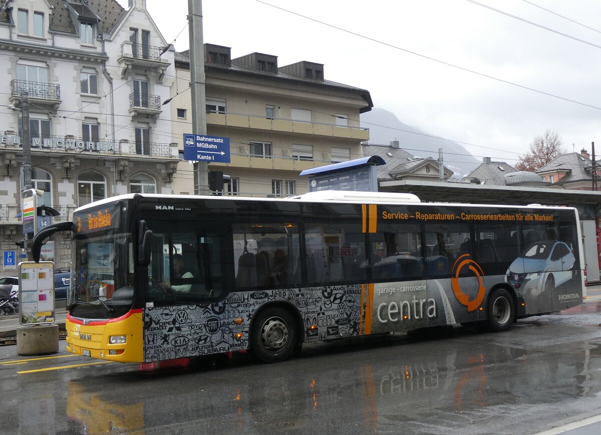 (270'005) - PostAuto Wallis - VS 449'120/PID 10'443 - MAN am 19. Dezember 2024 beim Bahnhof Brig