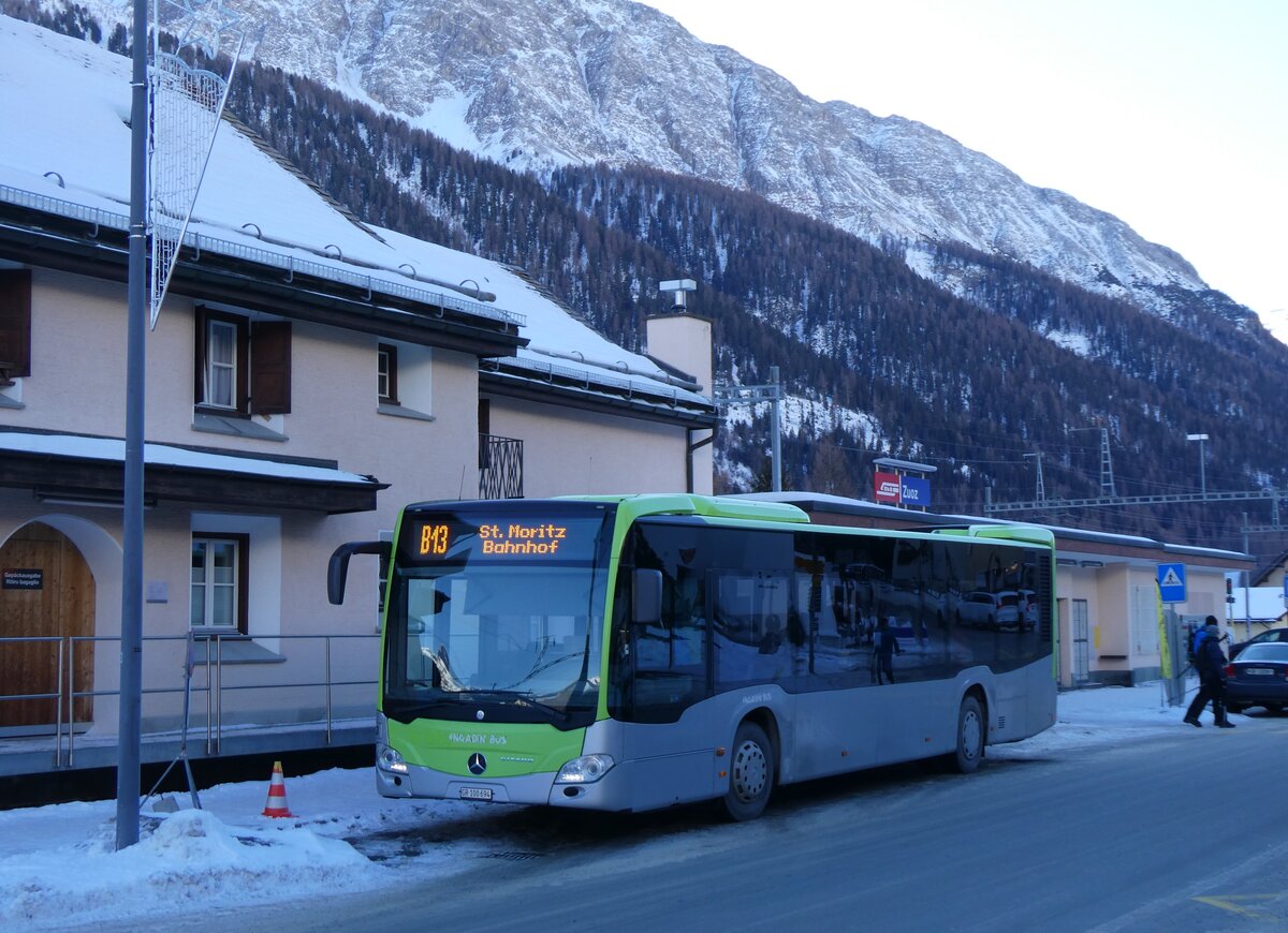 (270'248) - Engadin Bus, St. Moritz - GR 100'694 - Mercedes (ex Busland, Burgdorf Nr. 113) am 27. Dezember 2024 beim Bahnhof Zuoz