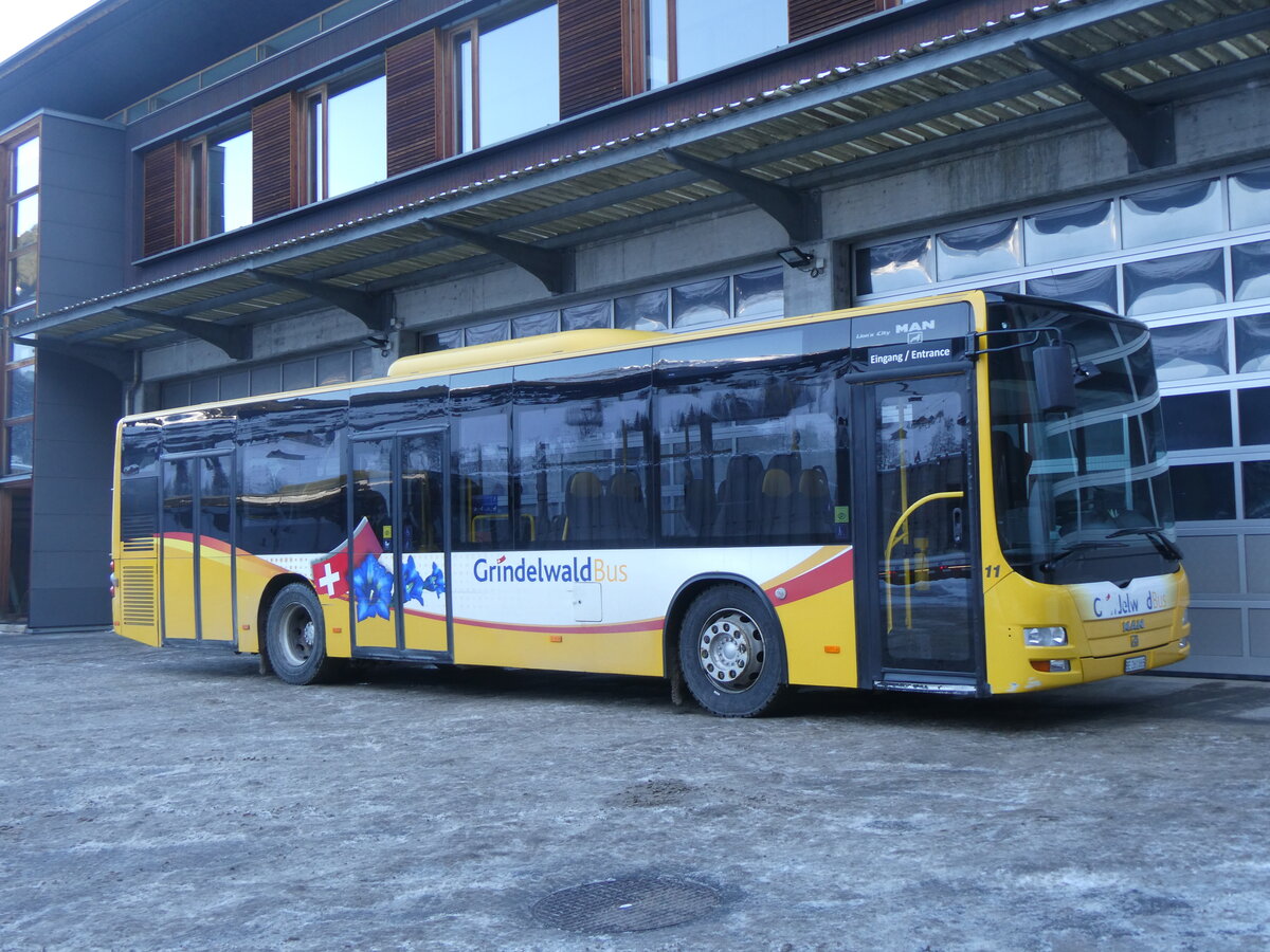 (271'252) - GrindelwaldBus, Grindelwald - Nr. 11/BE 261'865 - MAN/Gppel am 18. Januar 2025 in Grindelwald, Garage