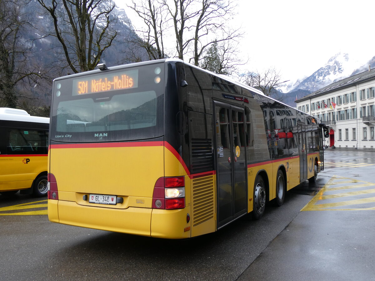 (271'863) - Niederer, Filzbach - GL 348/PID 5663 - MAN (ex Dnser, Trimmis) am 12. Februar 2025 beim Bahnhof Glarus