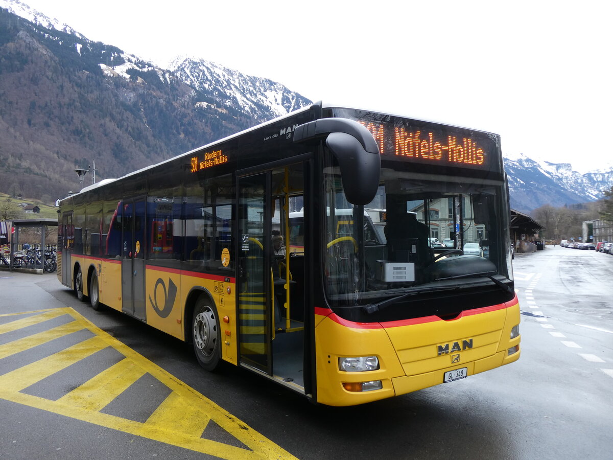 (271'866) - Niederer, Filzbach GL 348/PID 5663 - MAN (ex Dnser, Trimmis) am 12. Februar 2025 beim Bahnhof Glarus