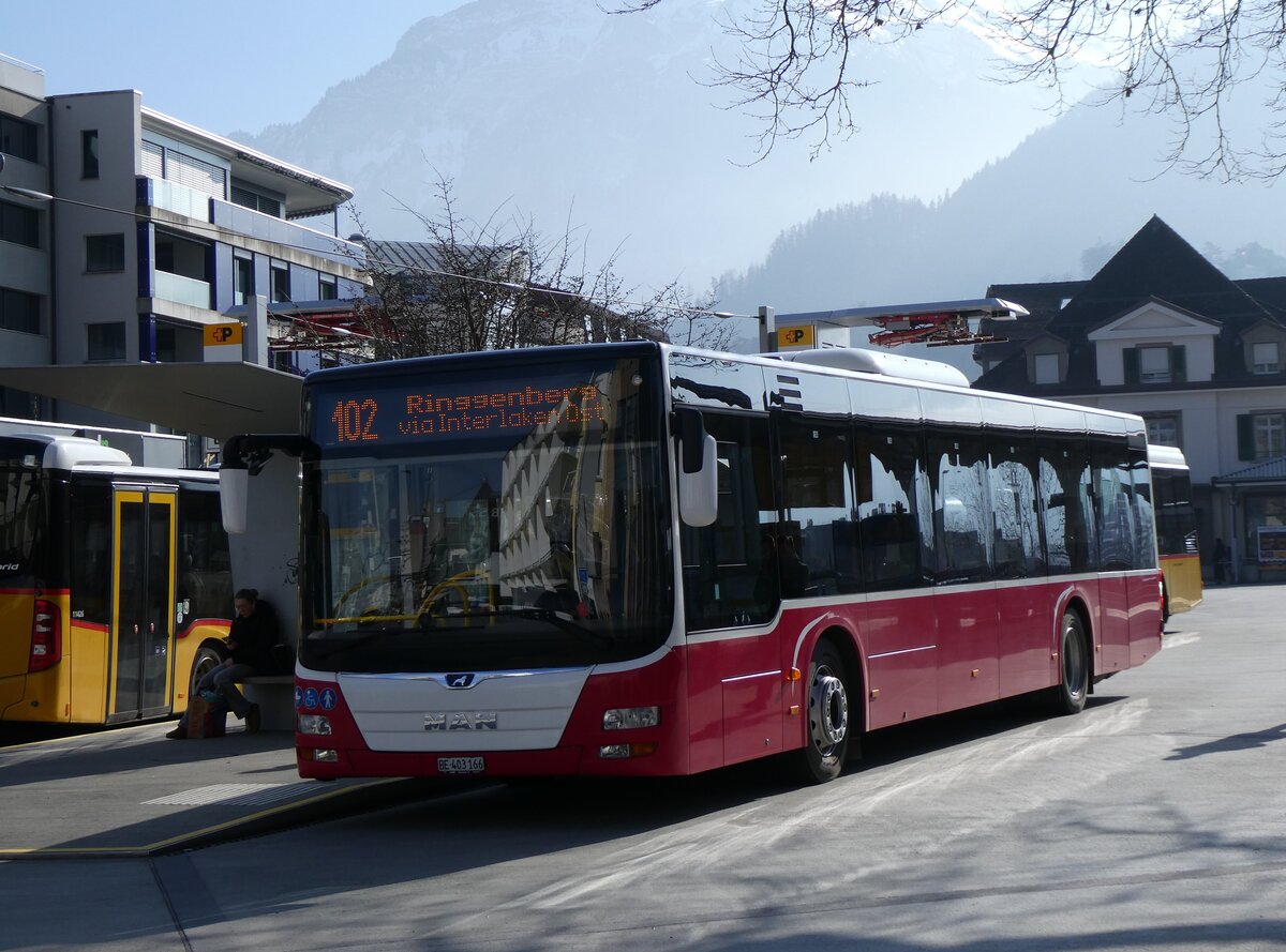 (272'209) - PostAuto Bern - BE 403'166/PID 12'336 - MAN (ex Dr. Richard, A-Wien Nr. 1411) am 17. Februar 2025 beim Bahnhof Interlaken West