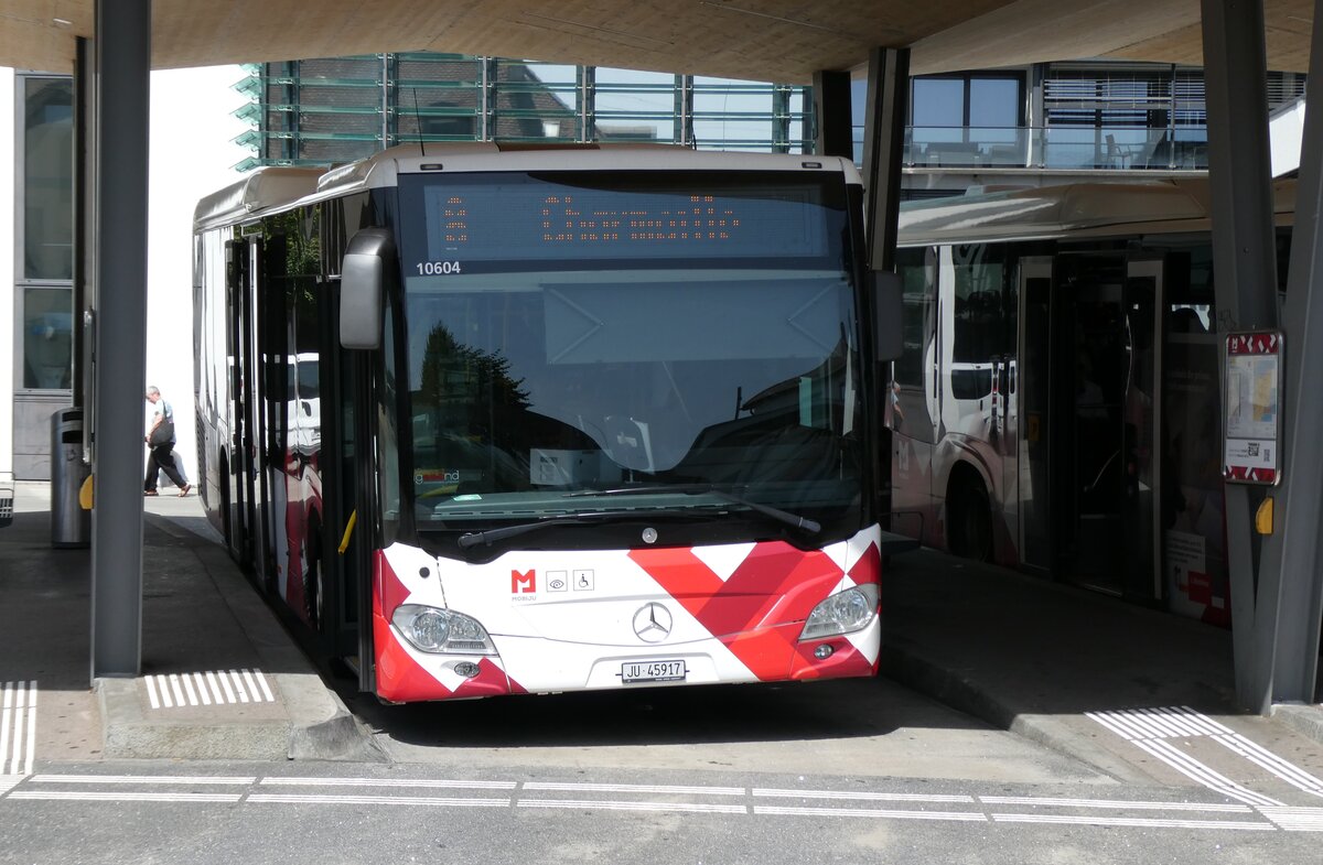 (278'834) - CarPostal Ouest - JU 45'917/PID 10'604 - Mercedes (ex JU 63'349; ex VD 464'947) am 14. August 2025 beim Bahnhof Delmont